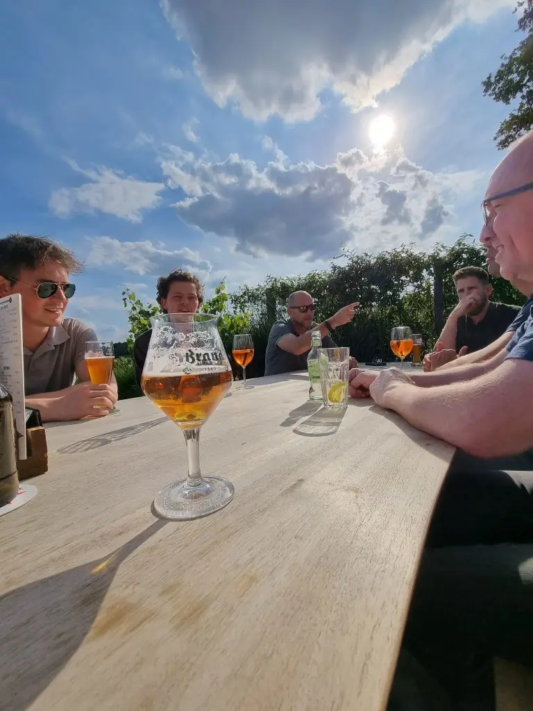 a group of people sitting at a table with drinks